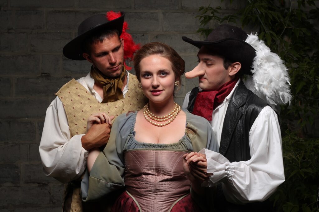 Two men and a woman in costume for the show Cyano.